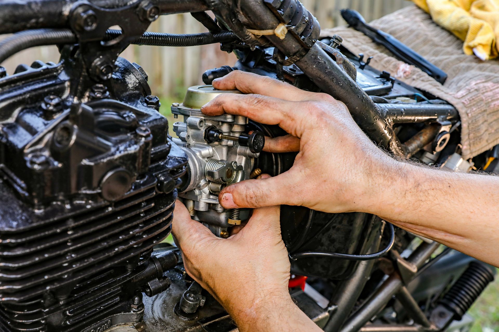 a person holding a car engine